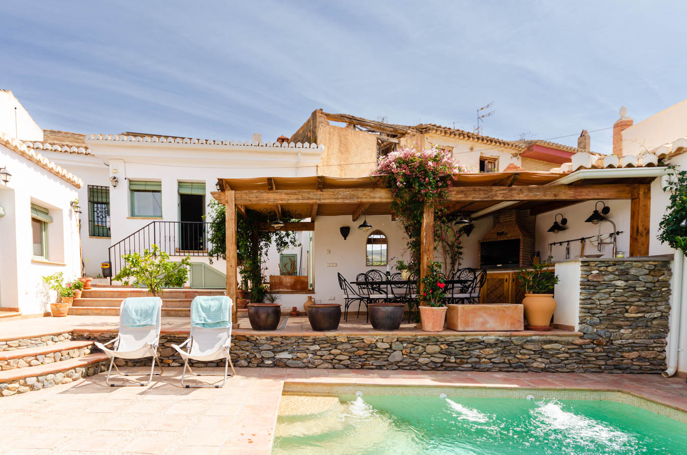 Pool terrace, barbecue area and main house